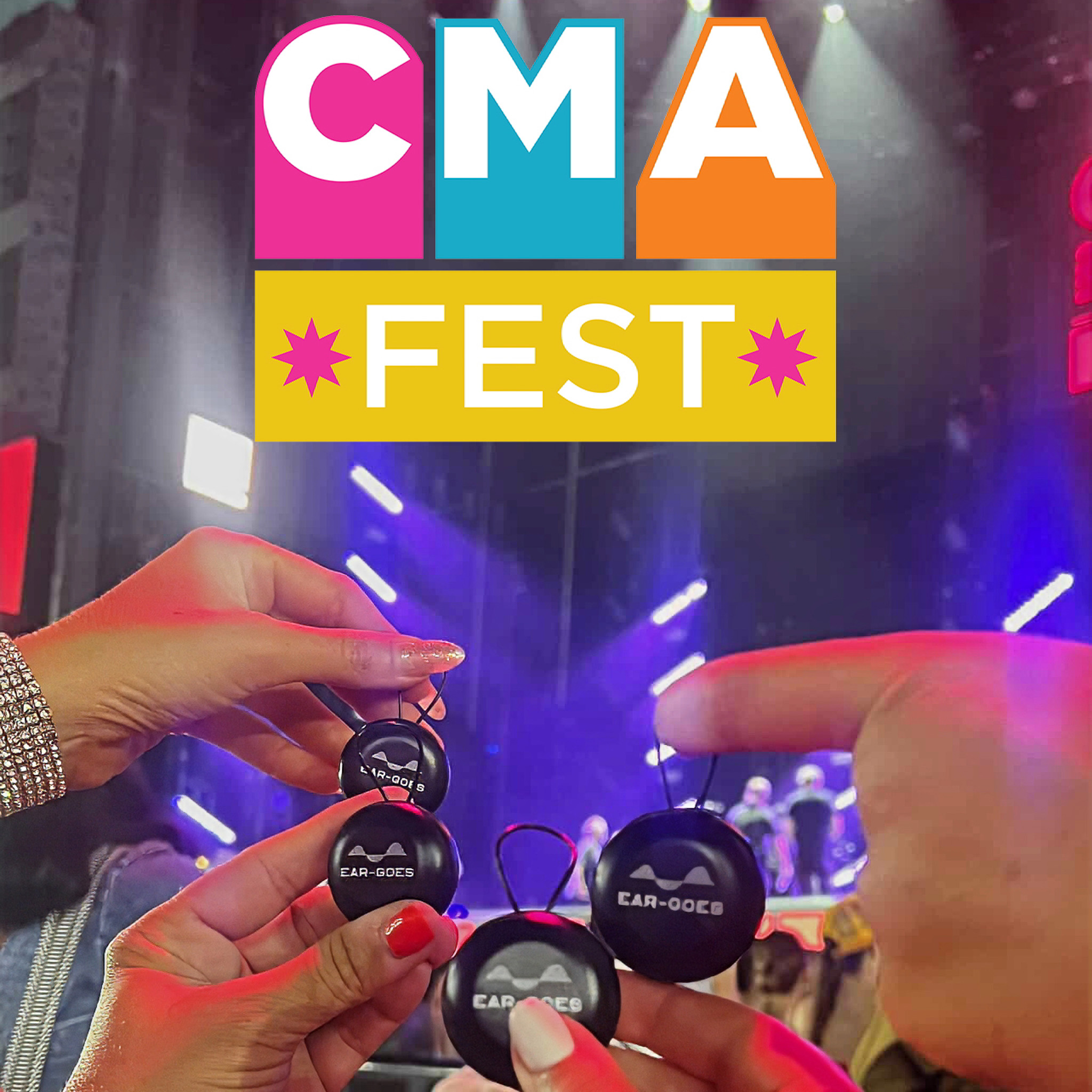 A group of people hold Ear-Goes earplug cases at CMA Fest